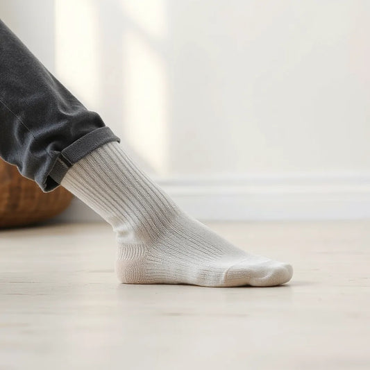 Non slip crew socks with visible textured grip on a clean studio floor